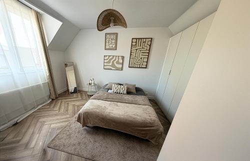 Ένα ή περισσότερα κρεβάτια σε δωμάτιο στο Le Cosy - Paisible - Confort - Parking