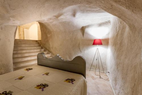 Postel nebo postele na pokoji v ubytování Casamata Matera
