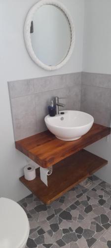 a bathroom with a sink and a mirror at 5 Cliff Street in Agulhas