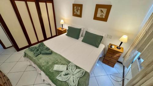 Ένα ή περισσότερα κρεβάτια σε δωμάτιο στο Real Residence coworking, conforto e piscina para até 5 pessoas