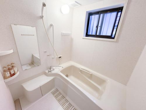 Koupelna v ubytování 十分钟到达Namba