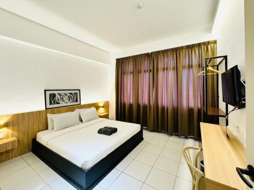 Ένα ή περισσότερα κρεβάτια σε δωμάτιο στο Hotel O Near Tawau Hospital Formerly Mangrove Hotel