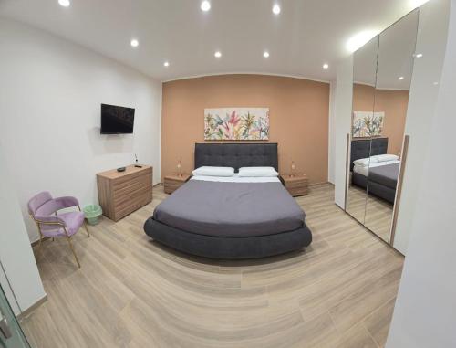 Ένα ή περισσότερα κρεβάτια σε δωμάτιο στο La Casa di MaMA