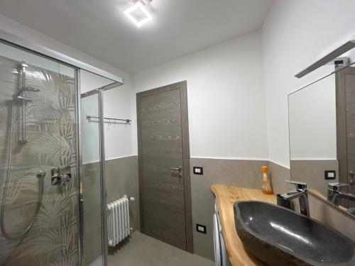 a bathroom with a sink and a shower at Al Mulino in Schilpario