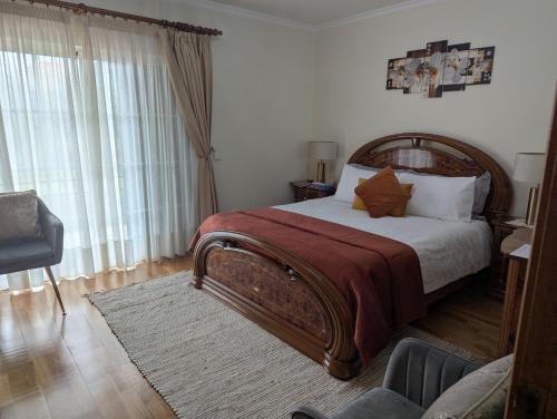 a bedroom with a large bed and a window at ZiZis Place in Santa Cruz