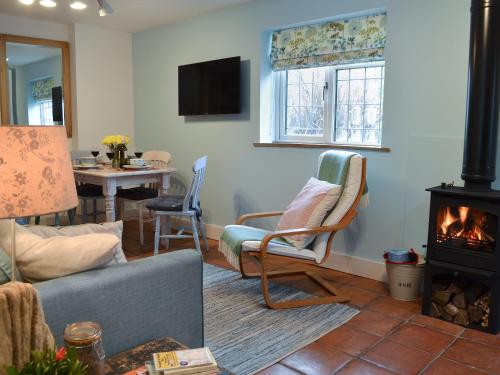 a living room with a couch and a fireplace at The Blue Loft in Rye