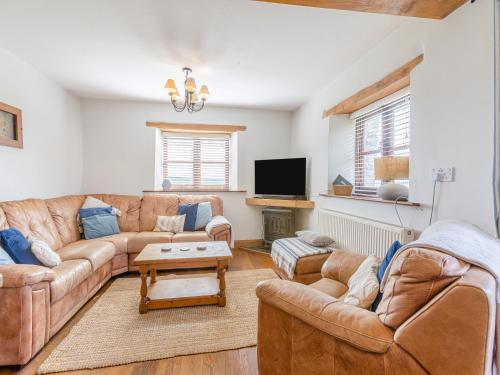 TV a/nebo společenská místnost v ubytování Smugglers Retreat