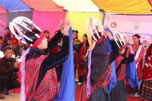 a group of women performing a performance in front of a crowd at Khasre Gurung Gaun Homestay in Nagarkot