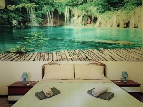 Giường trong phòng chung tại Villa Varano Borghi - Lake