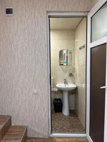 a bathroom with a sink and a mirror at Tbilisi historical center in Tbilisi City