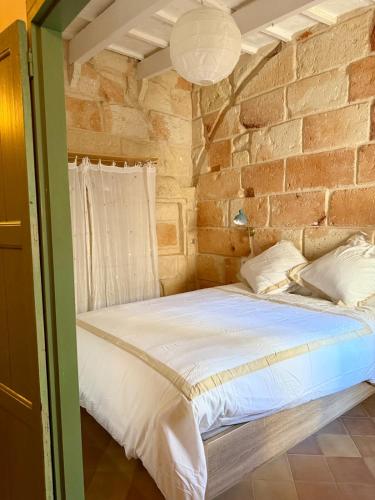 Postel nebo postele na pokoji v ubytování Caseta típica amb encant al Casc antic Ciutadella