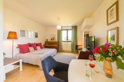 a living room with a bed and a table at grünraum Apartment in Kleinsöding