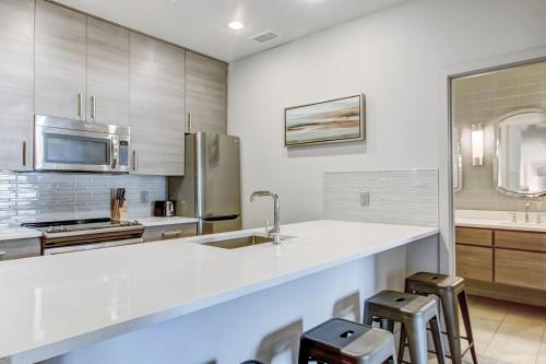 a kitchen with a white counter top and a sink at Parker's Collection Unit 6 in Savannah