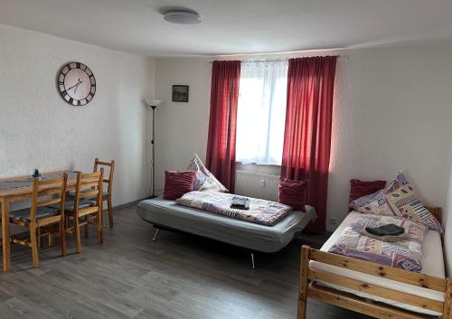 a room with a bed and a table and a dining room at Wohnung VS in Villingen-Schwenningen