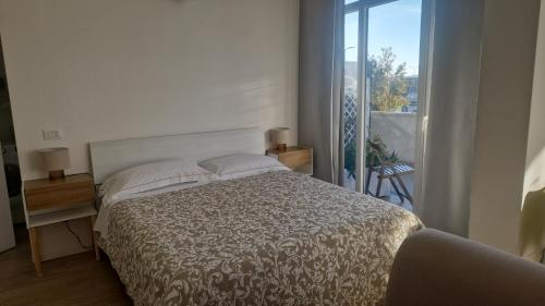 Ένα ή περισσότερα κρεβάτια σε δωμάτιο στο Cozy flat in Famagosta area near Forum di Assago