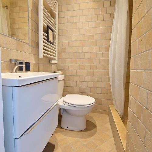 a bathroom with a toilet and a sink at Côté Vieil Antibes in Antibes