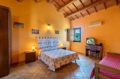 Ένα ή περισσότερα κρεβάτια σε δωμάτιο στο Nuraximannu Boutique B&B