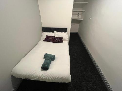 En eller flere senge i et værelse på Heath lodge