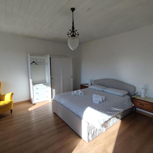 a bedroom with a bed with towels on it at Charme nel borgo - Appartamento Lina in Corniglio