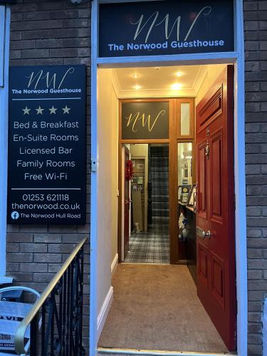 a sign for thenorwegian entrance to a house with a door at The Norwood Hotel in Blackpool