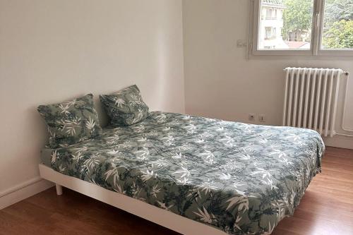 Ένα ή περισσότερα κρεβάτια σε δωμάτιο στο NIA REN Republique