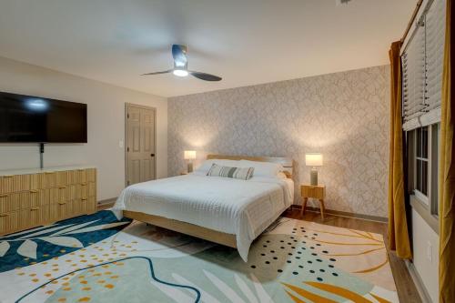 a bedroom with a bed and a flat screen tv at 5BR Private Ranch Pet Friendly in Wake Forest