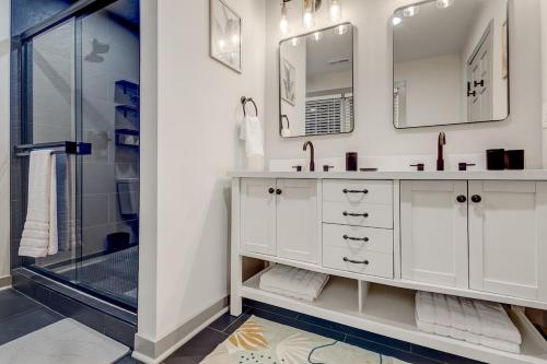a white bathroom with a sink and a shower at 5BR Private Ranch Pet Friendly in Wake Forest