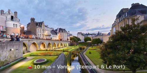 a bridge over a river in a city with buildings at Penn-ty in Ploeren