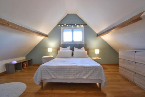 Postel nebo postele na pokoji v ubytování Le Cocon Bleu