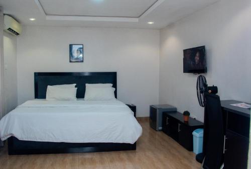 Ένα ή περισσότερα κρεβάτια σε δωμάτιο στο NV Apartments