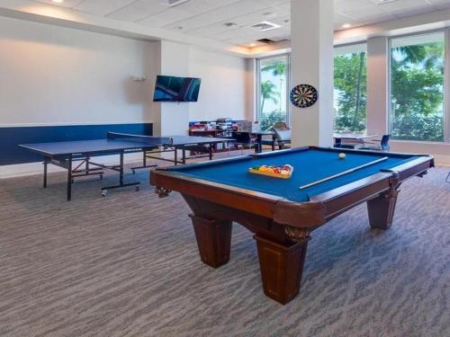 a billiard room with two tables and a pool table at Oasis Downtown Fort Myers, Pool, Parking ,Pet Friendly in Fort Myers