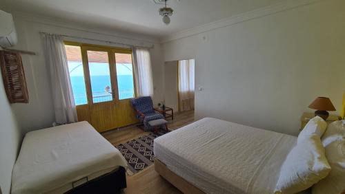 Postel nebo postele na pokoji v ubytování Uğrak Home