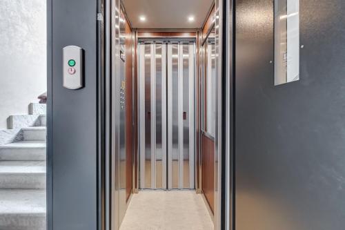 a hallway with a door with a smart door sensor at Relais San Giovanni in Rome