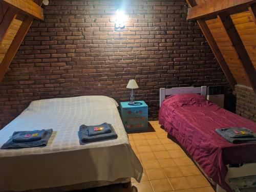 Letto o letti in una camera di La Alpina