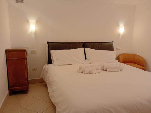 a bedroom with a bed with two towels on it at La Casetta in Ancona