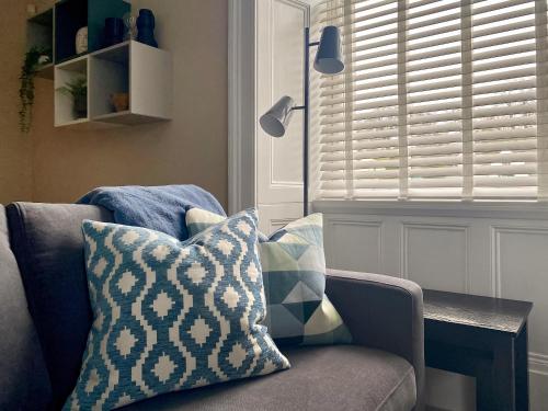 a living room with a couch and a window at 2 Harney Peak in Portinscale