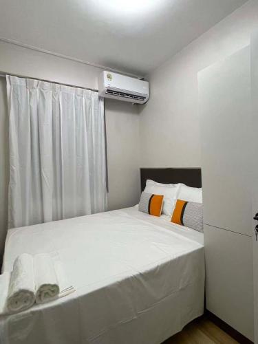 a small bedroom with two beds and a heater at Priscilla Apartment in Nadi