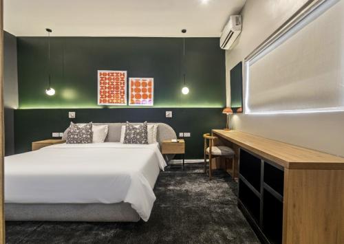 Postel nebo postele na pokoji v ubytování The Metropolis Lekki