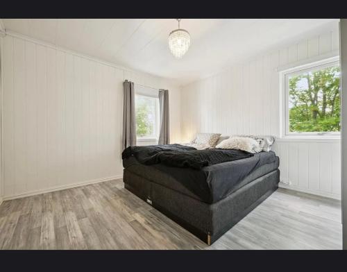 a bedroom with a bed in the corner of a room at Apartment in central Kirkenes in Kirkenes
