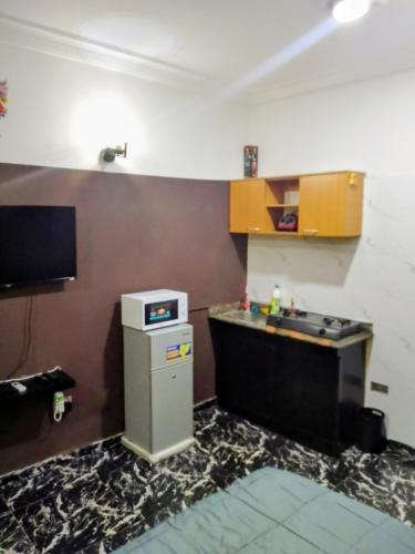 a small kitchen with a sink and a counter at Short Let Apartments in Lagos Business School Lekki Ajah in Lekki