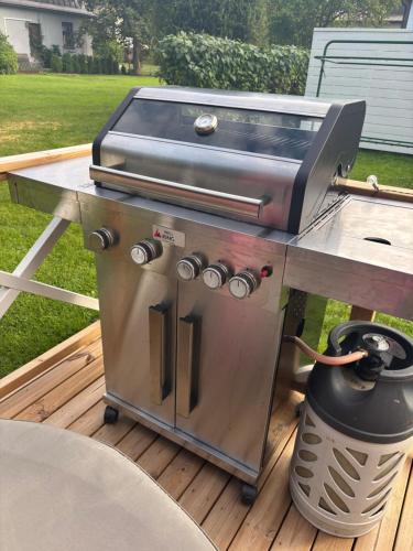 a grill sitting on top of a table on a deck at Villa Linnea in Hanko