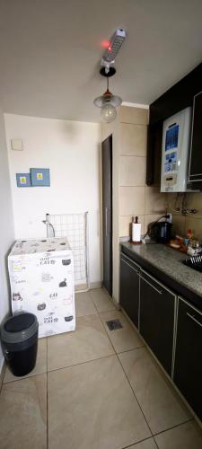 a kitchen with a sink and a counter top at Latidos del Sur in Ushuaia