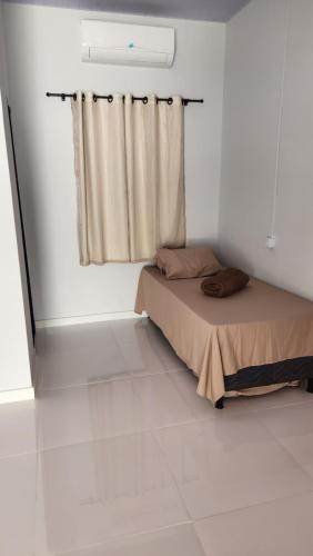 Postel nebo postele na pokoji v ubytování Marajó Suítes