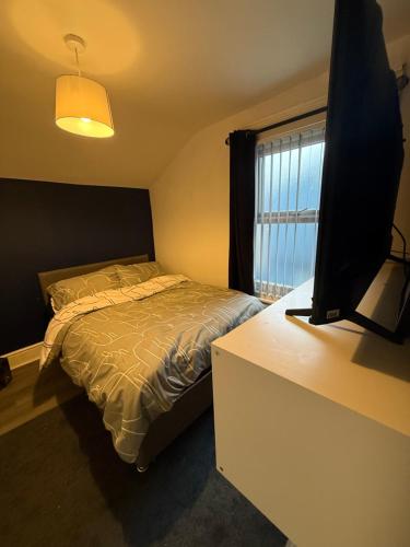 Ένα ή περισσότερα κρεβάτια σε δωμάτιο στο City Apartment