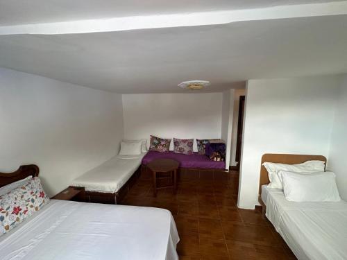 Ένα ή περισσότερα κρεβάτια σε δωμάτιο στο Nouara Appart'Hotel