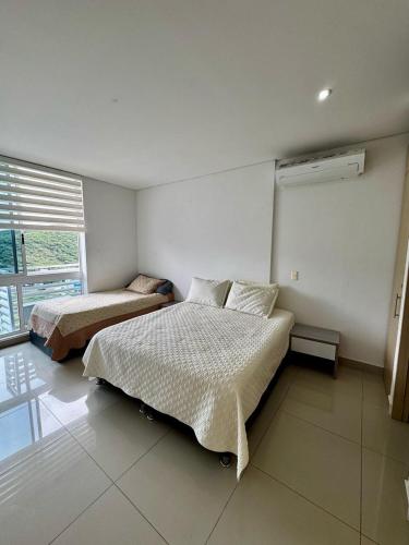 Postel nebo postele na pokoji v ubytování Salida directa a la playa T1