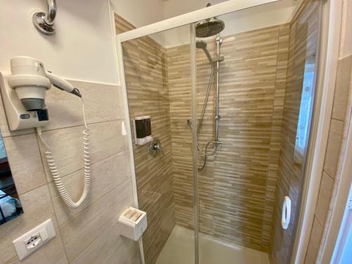 a bathroom with a shower with a shower head at La Casa Di Nonna Tella in Lenola