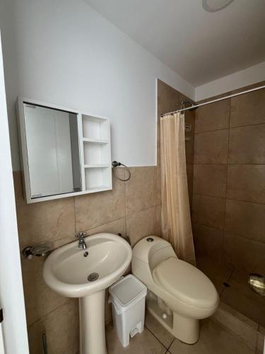 a small bathroom with a sink and a toilet at Apartment with Beach Exit 204 in Punta Negra