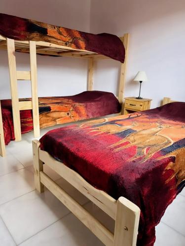 Ένα ή περισσότερα κρεβάτια σε δωμάτιο στο Vacaciones Mar del Tuyú