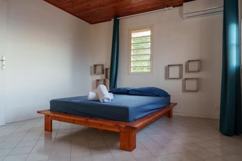 Ένα ή περισσότερα κρεβάτια σε δωμάτιο στο Villa Canelle